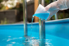 Adding chemicals to pool water